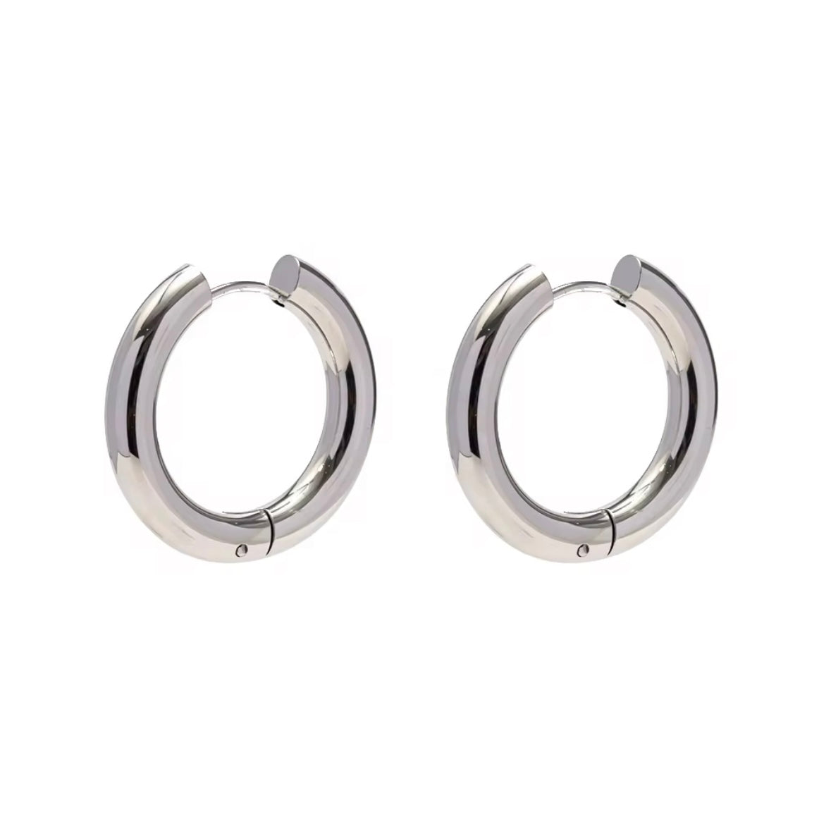 Indulge in the timeless elegance of our Celine Silver Hoop Earrings. Classic and must-have, these earrings are the perfect addition to any outfit. Elevate your style and make a statement with these exquisite hoops. You won&