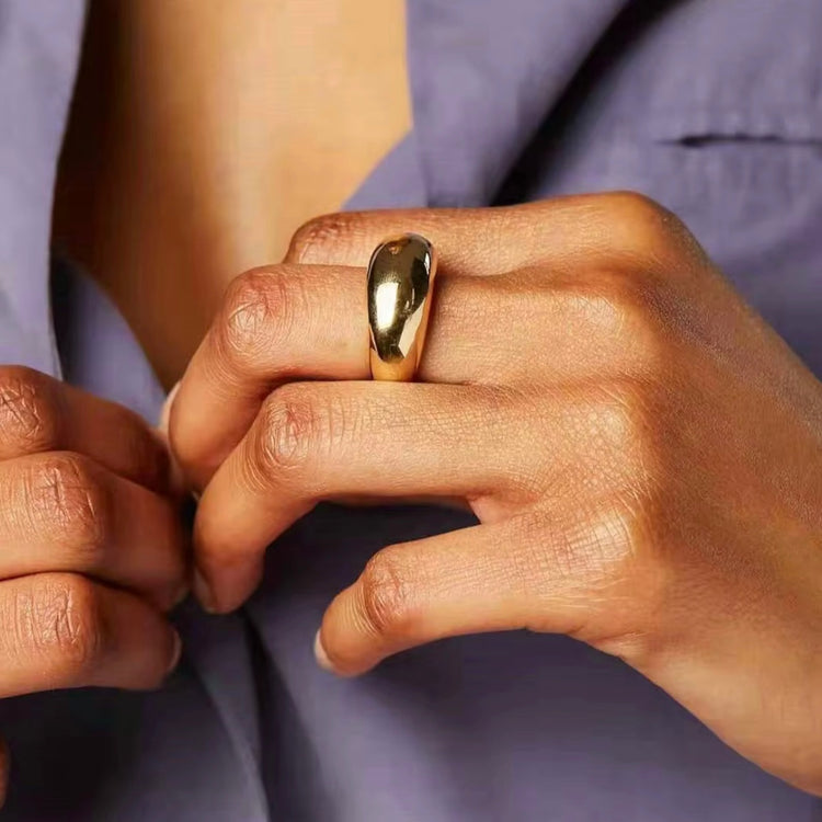 The Remi Ring boasts a unique arc shape, making it a bold statement piece for any outfit. Crafted with expert precision, this ring offers a sleek and modern design for those seeking a sophisticated accessory.&nbsp;

Stainless Steel 18K Gold PVD Plated - Made to last!

Hypoallergenic, Tarnish free Beach &amp; Pool Friendly