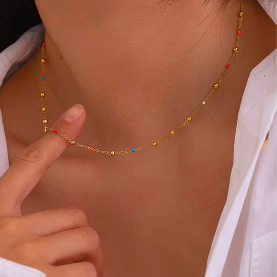 Add a pop of color to your summer look with our super dainty Colorful Enamel Small Beads Chain! Not only does it scream summer, but it&