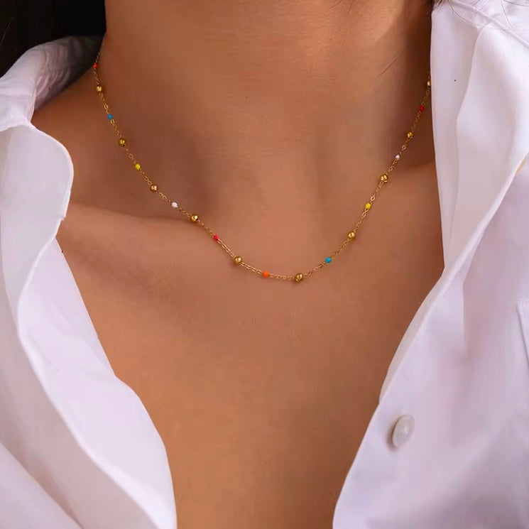 Add a pop of color to your summer look with our super dainty Colorful Enamel Small Beads Chain! Not only does it scream summer, but it&