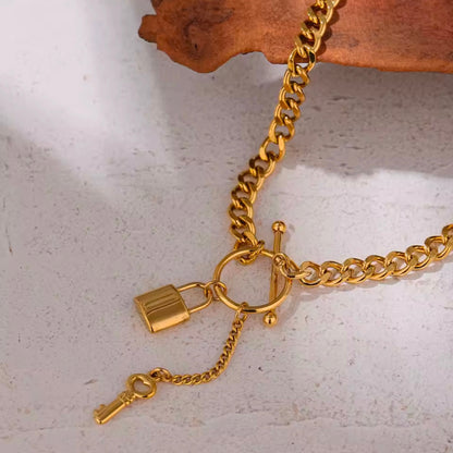 Add a touch of edge to your look with our Lock & Key Chain Necklace. The thick cuban link design is both bold and stylish, while the unique lock and key feature adds a touch of romance. A must-have statement piece for any fashionista.

Made to last! 

Tarnish and Water Resistant, Hypoallergenic

 

18 inches long 

 

18k Gold PVD Plated over 316L Stainless Steel base.  

 

 