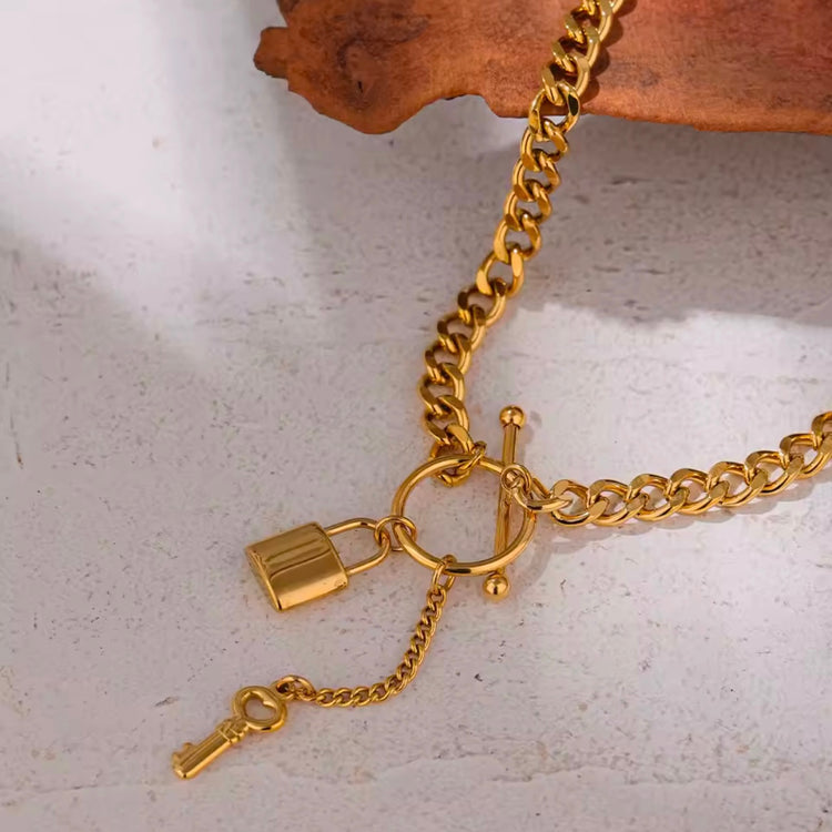 Add a touch of edge to your look with our Lock & Key Chain Necklace. The thick cuban link design is both bold and stylish, while the unique lock and key feature adds a touch of romance. A must-have statement piece for any fashionista.

Made to last! 

Tarnish and Water Resistant, Hypoallergenic

 

18 inches long 

 

18k Gold PVD Plated over 316L Stainless Steel base.  

 

 