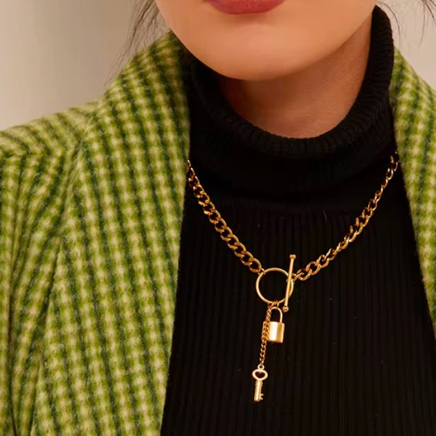 Add a touch of edge to your look with our Lock & Key Chain Necklace. The thick cuban link design is both bold and stylish, while the unique lock and key feature adds a touch of romance. A must-have statement piece for any fashionista.

Made to last! 

Tarnish and Water Resistant, Hypoallergenic

 

18 inches long 

 

18k Gold PVD Plated over 316L Stainless Steel base.  

 

 