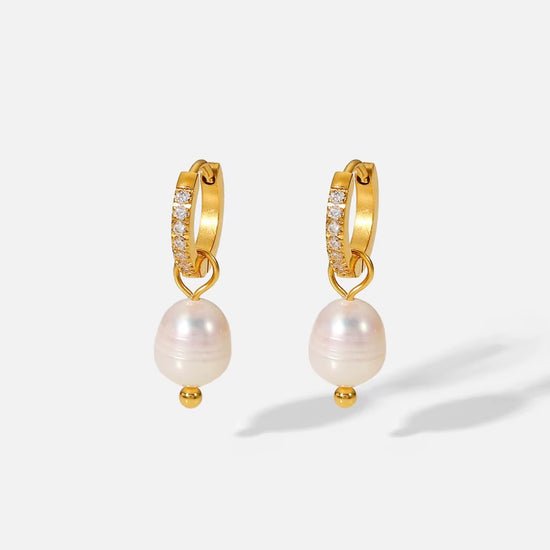 Hope you love or Allegra earring as much as we do. 
These classy babies will complete any outfit!

Made to last! 

Tarnish and Water Resistant. & Hypoallergenic

Latch hoop .5 inch x .5 inch 

18k Gold Plated over Stainless Steel  base.  

Fresh Water Pearl 

 

 .

 

 