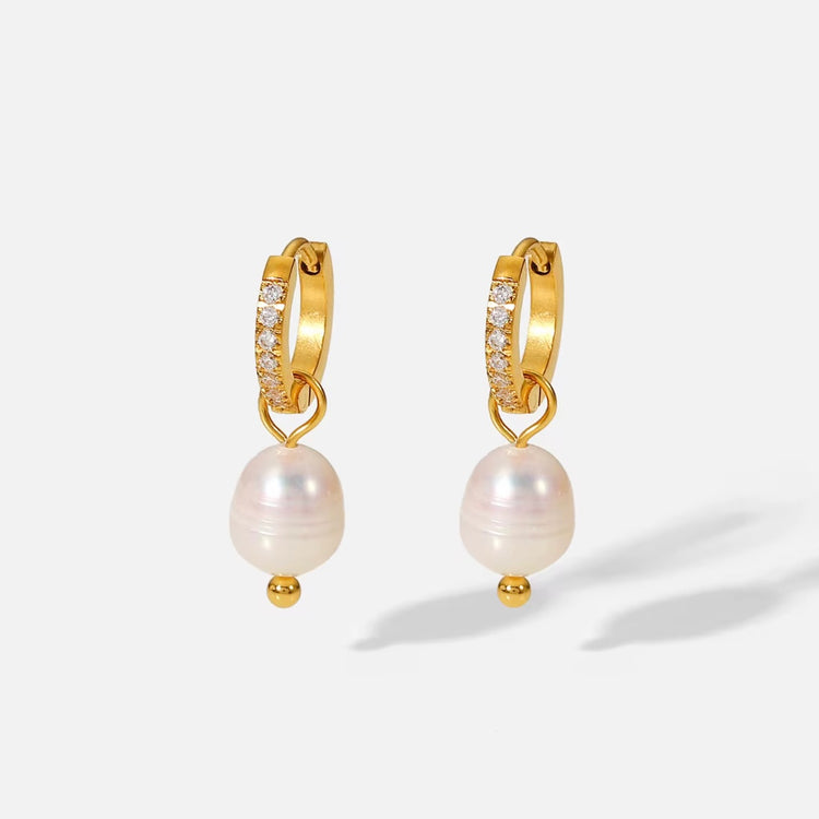 Hope you love or Allegra earring as much as we do. 
These classy babies will complete any outfit!

Made to last! 

Tarnish and Water Resistant. & Hypoallergenic

Latch hoop .5 inch x .5 inch 

18k Gold Plated over Stainless Steel  base.  

Fresh Water Pearl 

 

 .

 

 