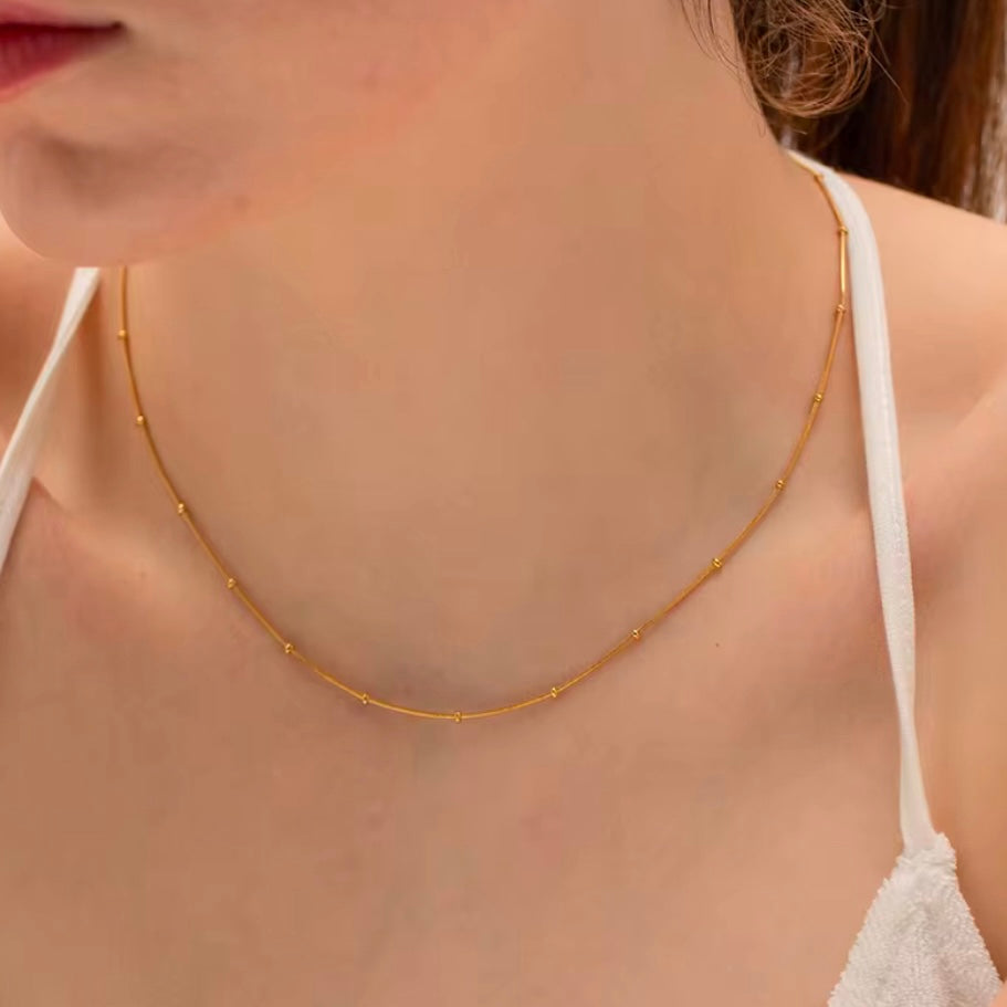 This delicate necklace is perfect for adding a touch of girly charm to any outfit. The thin bead chain adds a dainty and feminine look, making it an ideal accessory for any fashion-forward individual. A must-have for any jewelry collection!

Made to last! 

Tarnish and Water Resistant, Hypoallergenic

16.5 inches long- 2" Extension 

 

Closure :Lobster Clasp

18k Gold Plated over 316L Stainless Steel base.  

 

 