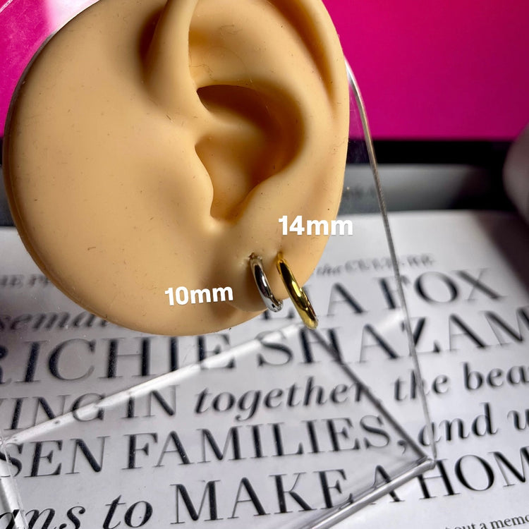 Upgrade your earring game with our Tiny Hoops Earrings. Their perfect size allows you to stack them up for multiple piercings or wear them as a single huggie, adding effortless style to any look. 

Made to last! Non Tarnish and Water Resistant, Hypoallergenic

10 mm diameter

14 mm diameter

18K Gold Plated over 316L Stainless Steel base

 

 