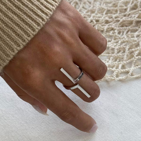 Inspire your style with our Tetris Open Ring! Embrace the geometric, unique design of this minimalistic piece. Stand out from the crowd with a touch of modernity and sophistication. Elevate any outfit and make a statement with this one-of-a-kind ring.

Metal:&nbsp; Stainless Steel

Hypoallergenic &amp; Water Resistant

Size: Adjustable Fits size 8/9