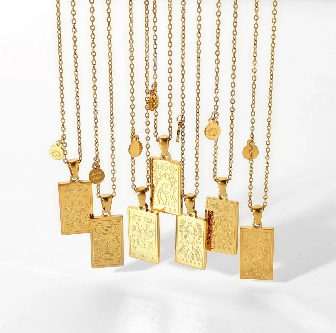 Zodiac reversible necklaces in 18K gold – astrology pendant jewelry with engraved zodiac signs and celestial symbols, perfect for layering.