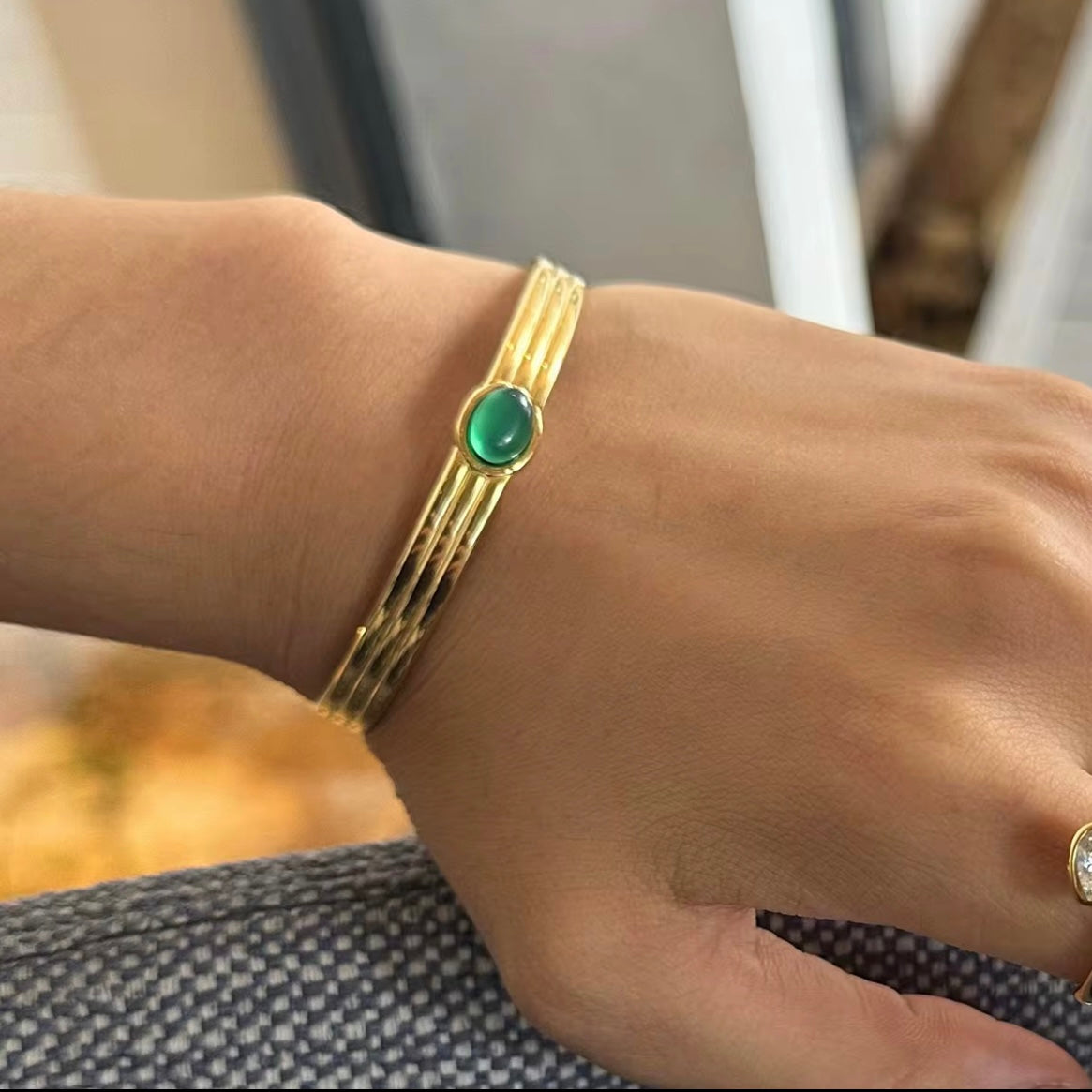 This beautiful, luxurious Green Agate Bangle Bracelet not only adds a touch of elegance to any outfit, but it also has potential benefits. Green agate is believed to improve decision-making, mental clarity, and emotional balance, making this a fashionable and beneficial addition to your jewelry collection!

316L Stainless Steel 18K PVD Gold Plated

Adjustable

Non Tarnish, Hypoallergenic and water resistant.