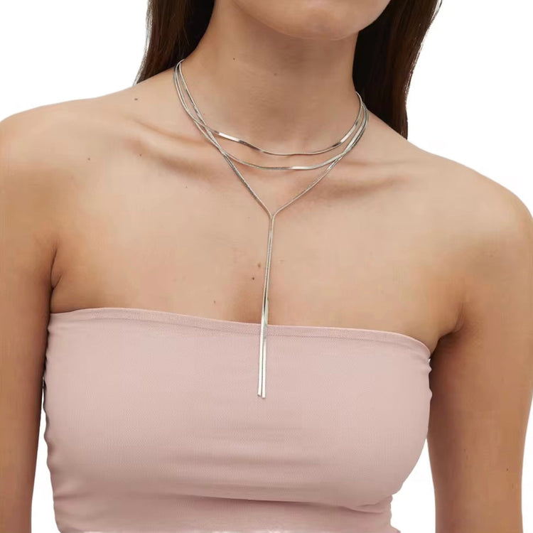 Model wearing Lonnie Y Snake Necklace in silver layered style