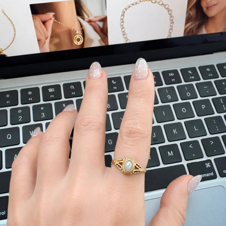 Margot vintage freshwater pearl gold ring worn on hand showing delicate oval pearl setting