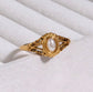 Side view of Margot vintage freshwater pearl ring showing intricate gold filigree band design