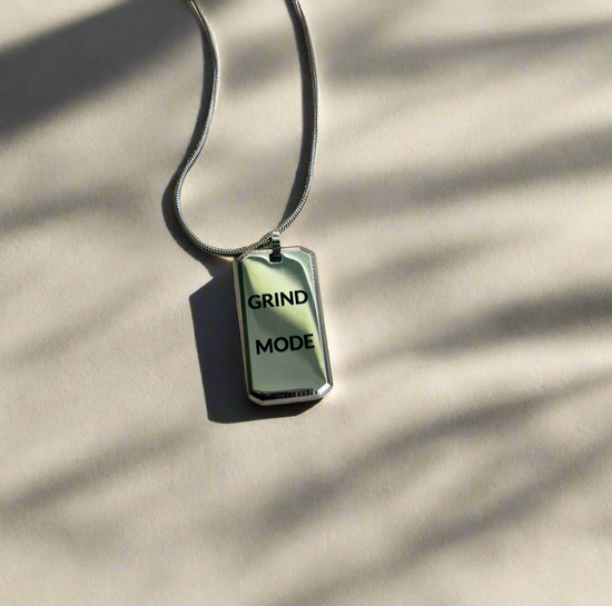 Necklace with a pendant that reads &