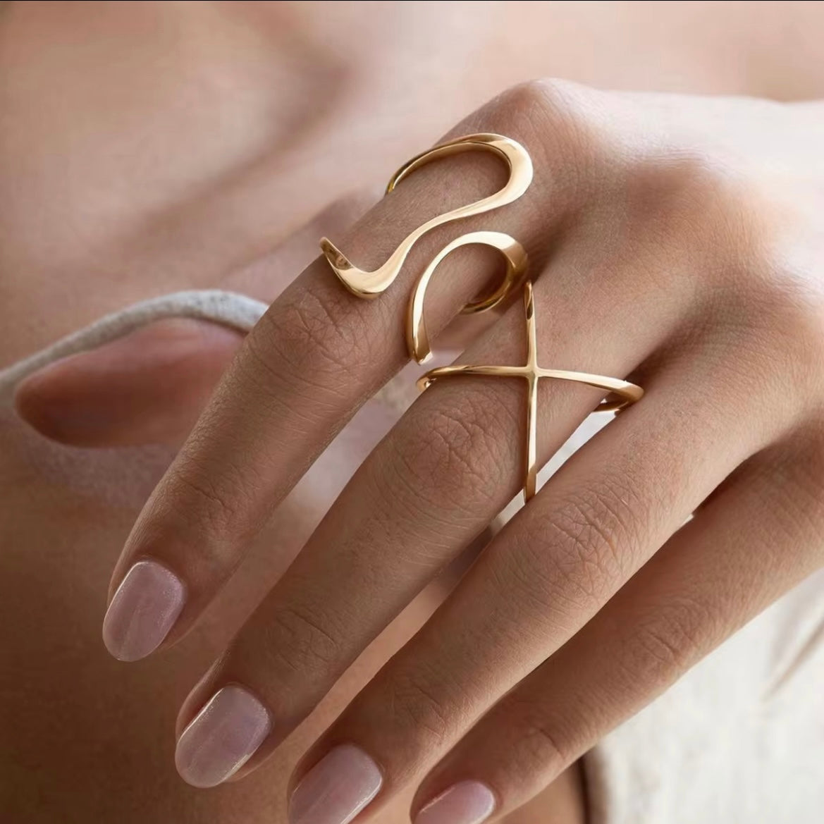 Nelly Abstract Rings feature an artistic and exclusive design, allowing you to choose between Wavy Lines or Cris Cross styles. Wavy Lines fit sizes 8 and 9, while Chris Cross fits sizes 7 and 8. Stand out with these unique rings.




Stainless Steel 18K Gold Plated - Made to last!

Hypoallergenic, Tarnish free , Water Resistant, Beach, Shower &amp; Gym Friendly

Wavy Lines -fits size 8,9

Cris Cross - fits size 7,8