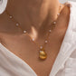 Discover the perfect accessory for any beach lover with our Under the Sea Necklace. This beachy necklace will transport you to forever summer vibes with its charming shell, starfish, and pearl charms. Embrace your inner mermaid and add a touch of whimsy to any outfit.

.

Made to last!&nbsp;Tarnish and Water Resistant, Hypoallergenic

16" long +2" ext

Closure : Lobster Clasp




18k Gold PVD Plated over 316L Stainless Steel base