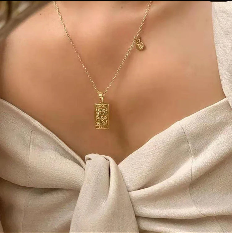Gold zodiac sign necklace with intricate engraving – minimalist astrology jewelry for everyday wear and spiritual connection.