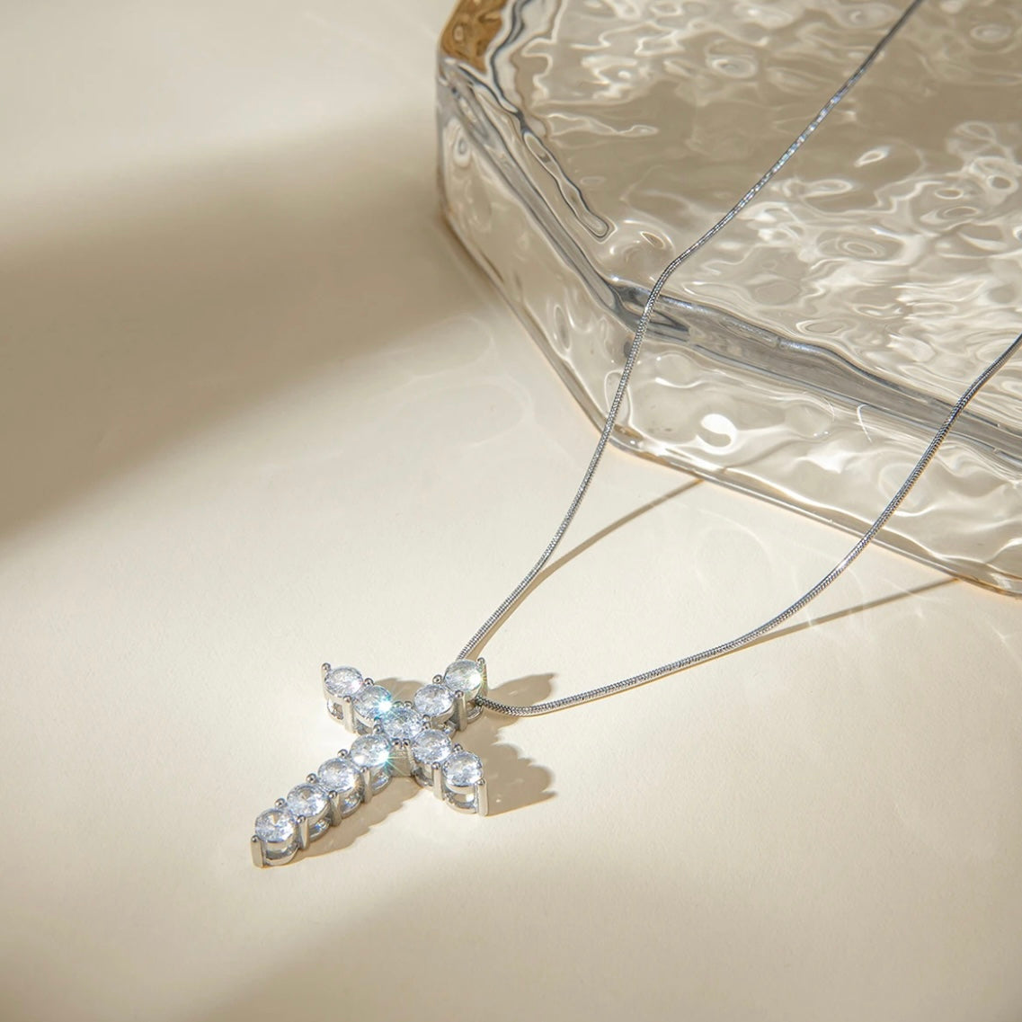 Embrace timeless beauty with our Statement Rhinestone Cross Necklace. Each sparkling stone exudes elegance, making a bold statement that is sure to elevate any outfit. Perfect for any occasion, this necklace is a must-have in your jewelry collection. Shine on with this beautiful, timeless piece.

Made to last!&nbsp;Tarnish and Water Resistant, Hypoallergenic

20" long +2" ext

Closure : Lobster Clasp

Cross 1.3"

316L Stainless Steel&nbsp;


