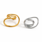Gold and silver Sam adjustable spiral ring on white background, modern open wrap statement ring.