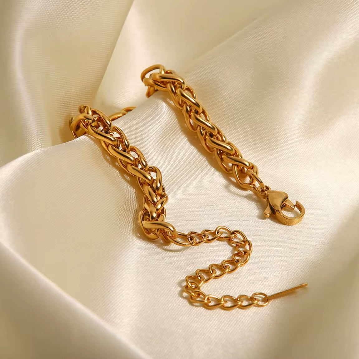 The Paola Bracelet boasts a timeless woven design and is crafted to resist tarnishing, ensuring its elegance and quality lasts for years to come. Exude sophistication and effortless style with this beautiful accessory.



316L Stainless Steel 18K PVD Gold Plated

6.5 inches long +2" inches ext