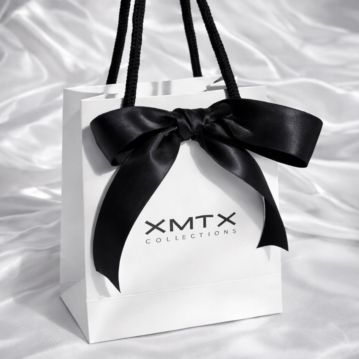 ELSSIZ signature white gift bag with black rope handles and logo, luxury jewelry packaging front view