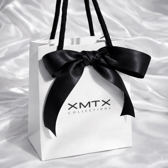 ELSSIZ signature white gift bag with black rope handles and logo, luxury jewelry packaging front view