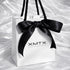ELSSIZ signature white gift bag with black rope handles and logo, luxury jewelry packaging front view