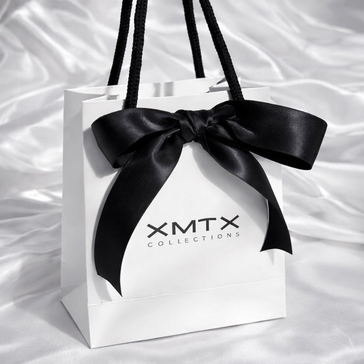 ELSSIZ signature white gift bag with black rope handles and logo, luxury jewelry packaging front view