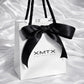 ELSSIZ signature white gift bag with black rope handles and logo, luxury jewelry packaging front view
