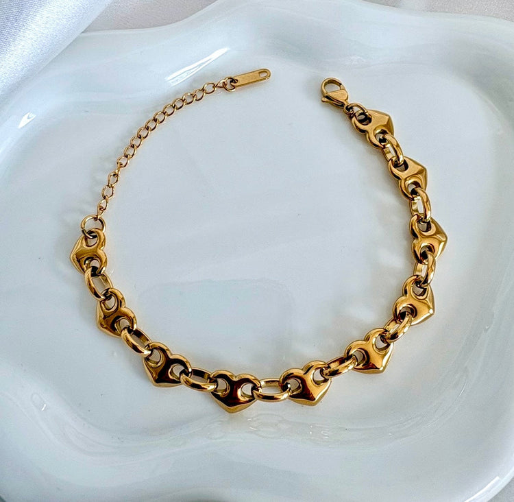 Gold puffy heart link bracelet featuring sculpted heart design, waterproof stainless steel jewelry