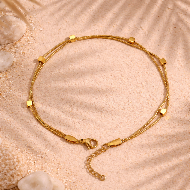 Isabelle 18K gold beaded anklet with palm shadow on sand minimalist Florida inspired jewelry