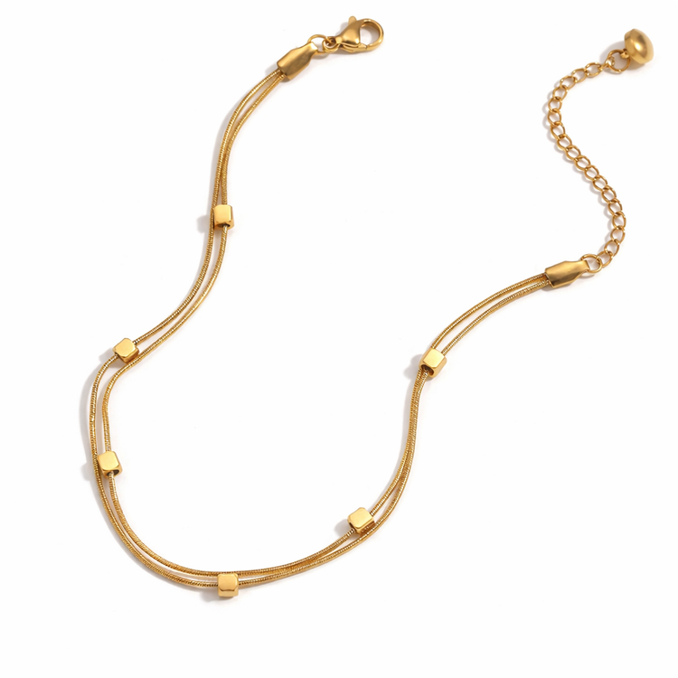 Isabelle 18K gold beaded snake chain anklet made of waterproof stainless steel on white background