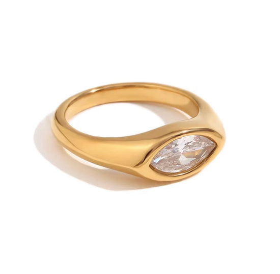 Close-up of Luma gold marquise cut clear stone ring on white background, non tarnish modern ring