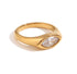 Close-up of Luma gold marquise cut clear stone ring on white background, non tarnish modern ring