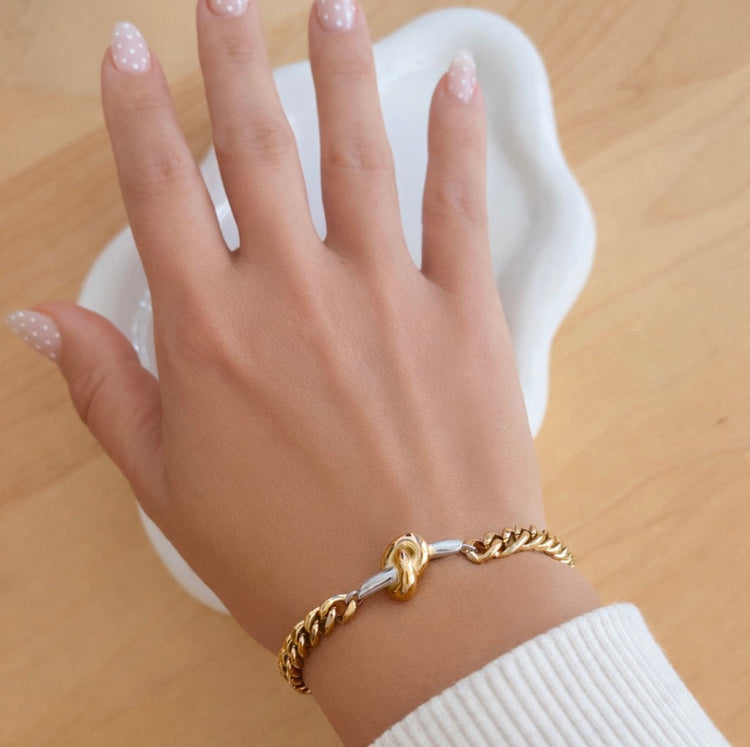 Woman wearing Nina two tone gold and silver curb chain bracelet waterproof stainless steel jewelry