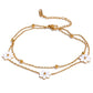 Add a touch of whimsy to your outfit with our Mother of Pearl Flowers Anklet. Delicate and dainty, this anklet features pretty, natural shell flowers that will elevate any look. Perfect for those who want to add a fun and playful touch to their style.

&nbsp;

This piece is made to last, hypoallergenic anti tarnish &amp; water resistant&nbsp;

316L Stainless Steel 18K Gold Plated

8.5 inches long +2 inches ext