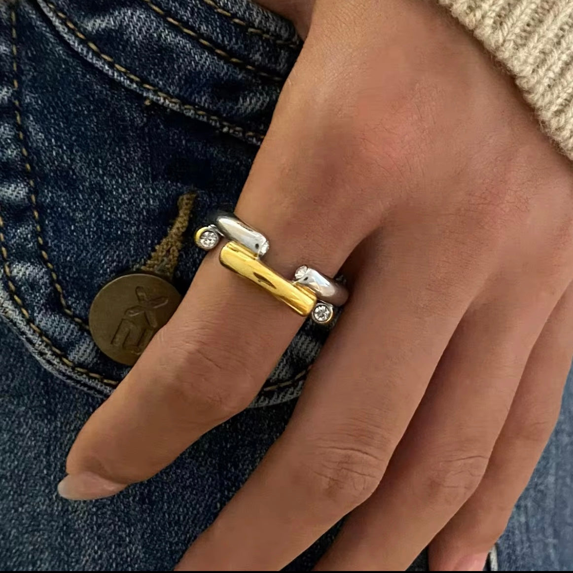 The Angelika Open Band Ring is a stunning embodiment of modern elegance and sophistication. With a seamless blend of gold and silver tones, this ring exudes luxury and versatility. Made with a durable and comfortable design, it is the perfect statement piece for any occasion.

Metal:&nbsp; Stainless Steel

Hypoallergenic AND; Water Resistant

Size: 7 only