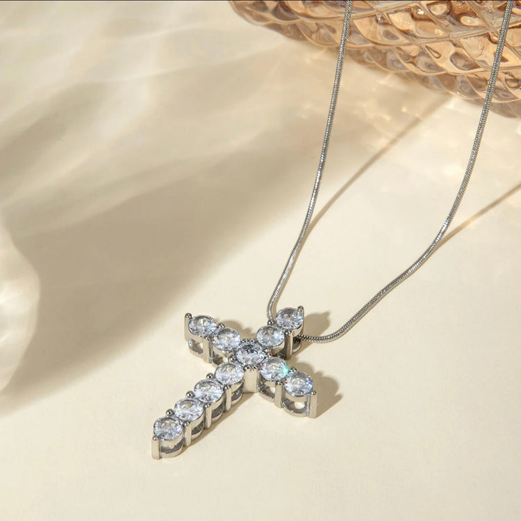 Embrace timeless beauty with our Statement Rhinestone Cross Necklace. Each sparkling stone exudes elegance, making a bold statement that is sure to elevate any outfit. Perfect for any occasion, this necklace is a must-have in your jewelry collection. Shine on with this beautiful, timeless piece.

Made to last!&nbsp;Tarnish and Water Resistant, Hypoallergenic

20" long +2" ext

Closure : Lobster Clasp

Cross 1.3"

316L Stainless Steel&nbsp;


