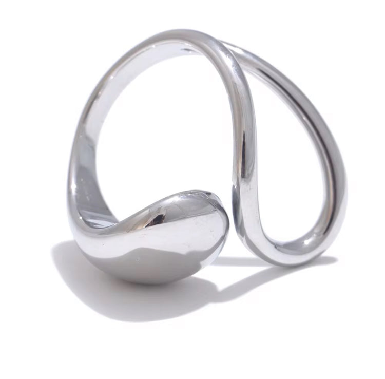 Experience the art of modern luxury with our Galiya Open Ring. The abstract open design creates a sophisticated and exclusive statement piece, sure to start conversations. Elevate your style and be the center of attention with this uniquely elegant ring.

Fits SIZE - 6/7/8 Adjustable

Stainless Steel 18K Gold PVD Plated - Made to last!

Hypoallergenic, Tarnish free 