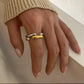The Angelika Open Band Ring is a stunning embodiment of modern elegance and sophistication. With a seamless blend of gold and silver tones, this ring exudes luxury and versatility. Made with a durable and comfortable design, it is the perfect statement piece for any occasion.

Metal:&nbsp; Stainless Steel

Hypoallergenic &amp; Water Resistant

Size: 7 only