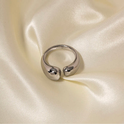 Silver Veda open statement ring on silk background, adjustable waterproof non tarnish ring