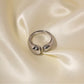 Silver Veda open statement ring on silk background, adjustable waterproof non tarnish ring