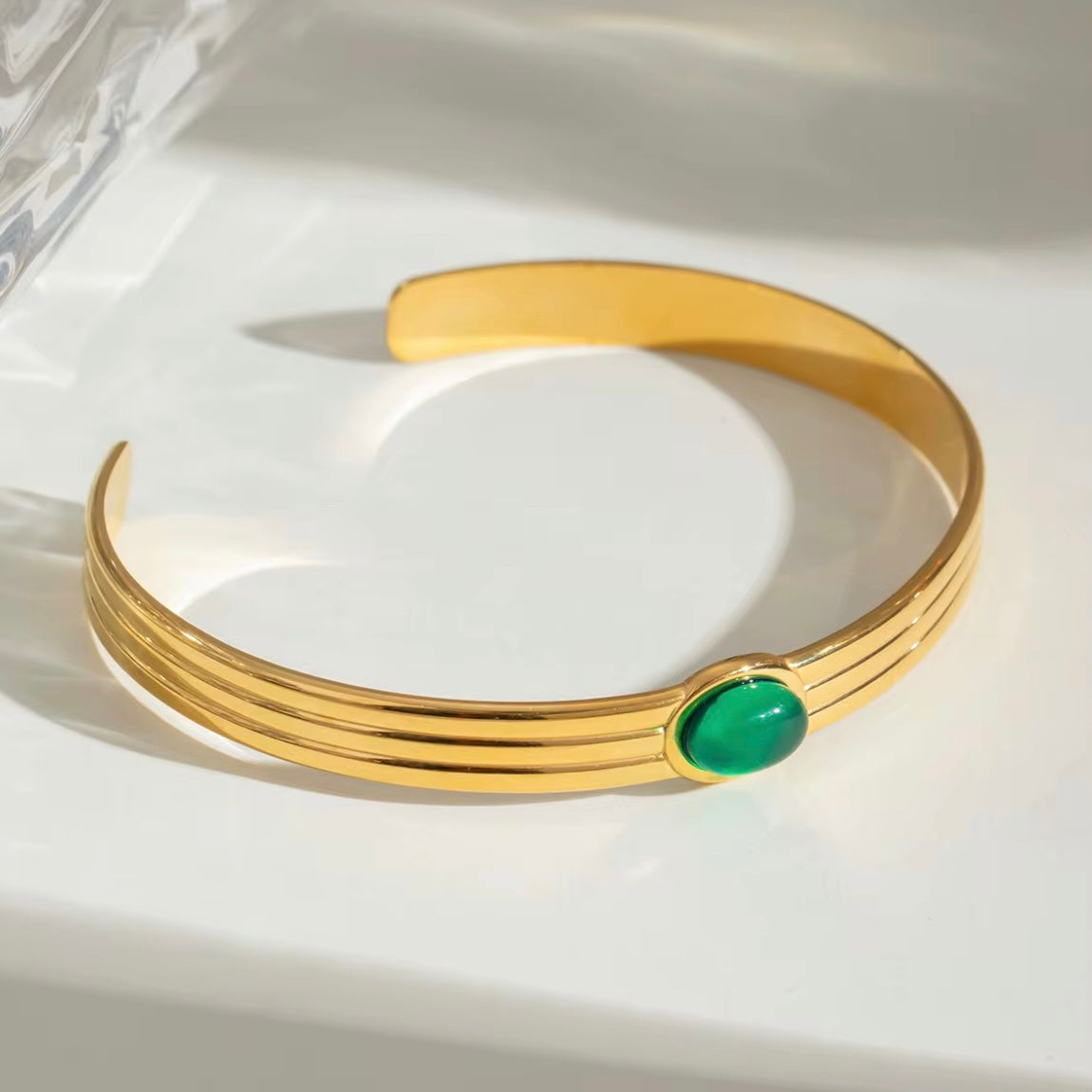 This beautiful, luxurious Green Agate Bangle Bracelet not only adds a touch of elegance to any outfit, but it also has potential benefits. Green agate is believed to improve decision-making, mental clarity, and emotional balance, making this a fashionable and beneficial addition to your jewelry collection!

316L Stainless Steel 18K PVD Gold Plated

Adjustable

Non Tarnish, Hypoallergenic and water resistant.