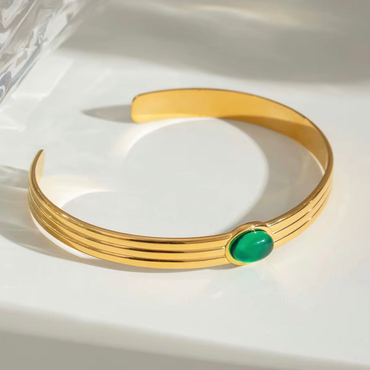 This beautiful, luxurious Green Agate Bangle Bracelet not only adds a touch of elegance to any outfit, but it also has potential benefits. Green agate is believed to improve decision-making, mental clarity, and emotional balance, making this a fashionable and beneficial addition to your jewelry collection!

316L Stainless Steel 18K PVD Gold Plated

Adjustable

Non Tarnish, Hypoallergenic and water resistant.