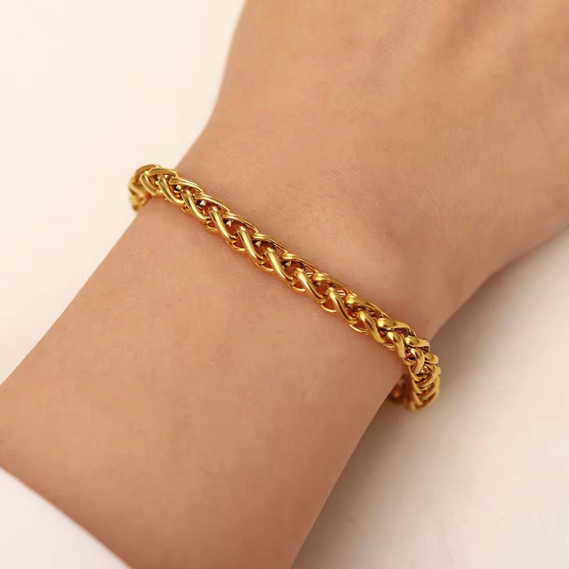 The Paola Bracelet boasts a timeless woven design and is crafted to resist tarnishing, ensuring its elegance and quality lasts for years to come. Exude sophistication and effortless style with this beautiful accessory.



316L Stainless Steel 18K PVD Gold Plated

6.5 inches long +2" inches ext
