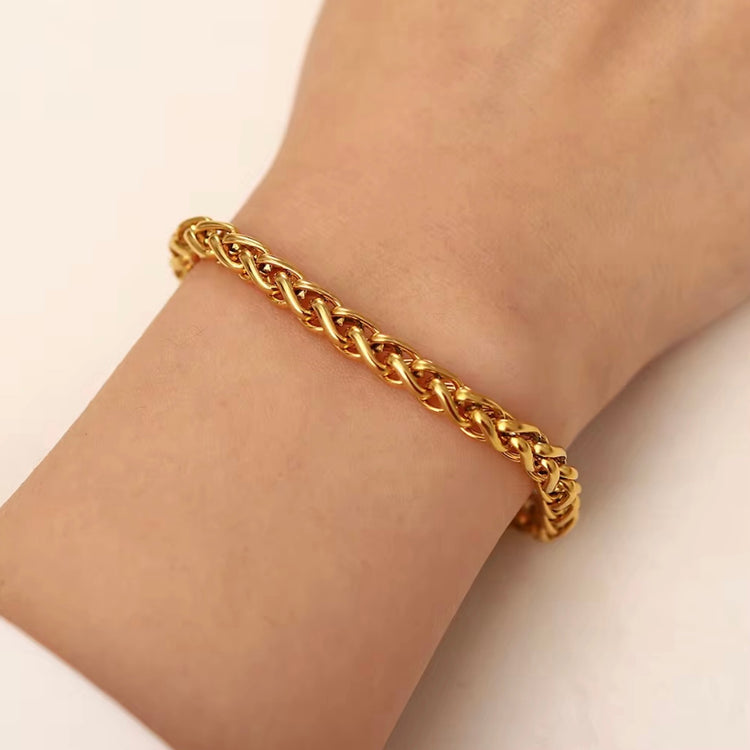 The Paola Bracelet boasts a timeless woven design and is crafted to resist tarnishing, ensuring its elegance and quality lasts for years to come. Exude sophistication and effortless style with this beautiful accessory.



316L Stainless Steel 18K PVD Gold Plated

6.5 inches long +2" inches ext